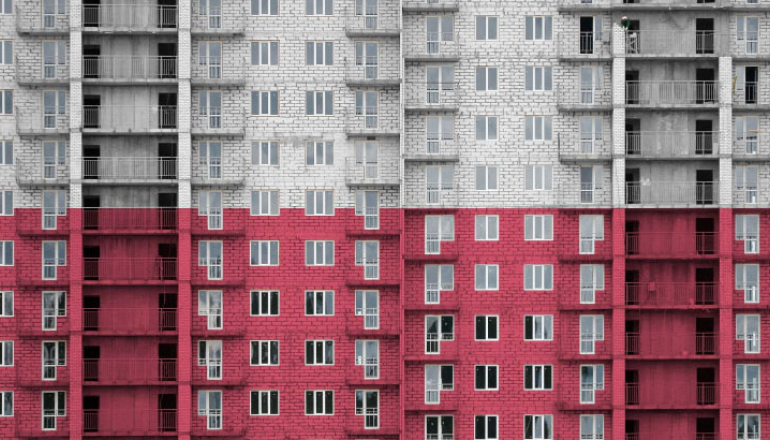 grafika, blok mieszkaniowy w biało-czerwonej barwie