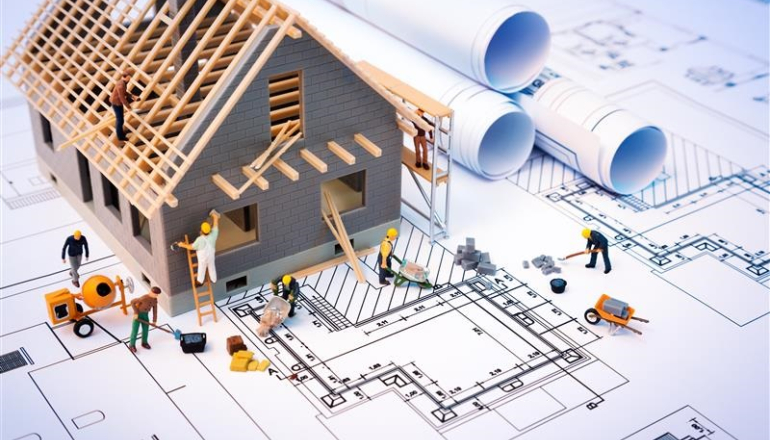 na grafice, dom w budowie i pracownicy budowy