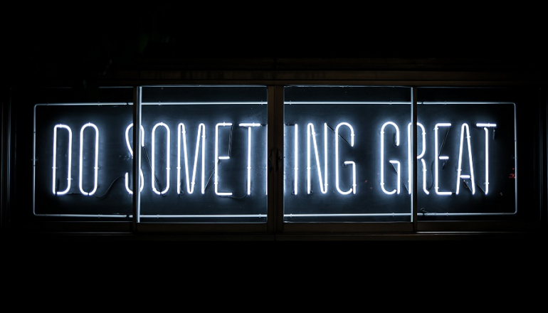 neon sign with slogan: Do something great