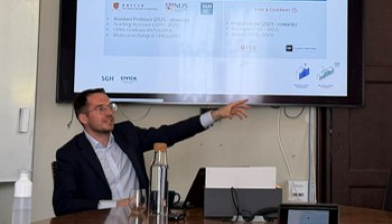 a man pointing out the screen