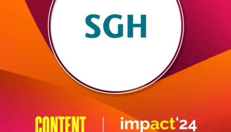Grafika pomarańczowo-bordowa w środku białe koło, a w w nim logo SGH