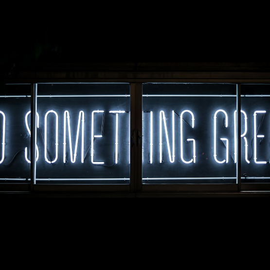 neon sign with slogan: Do something great