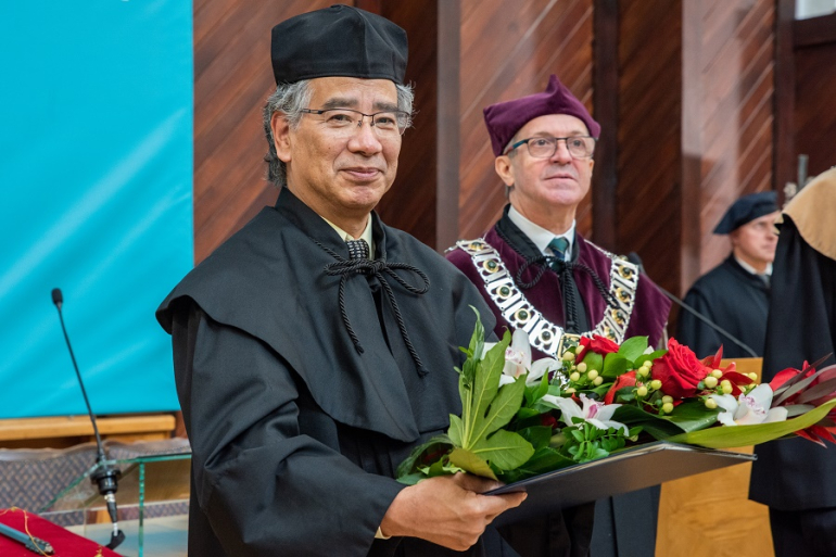 two men, including one wearing a rector’s robe